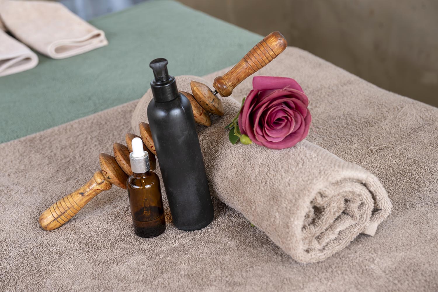 Massage oils, towels and wooden massage tools