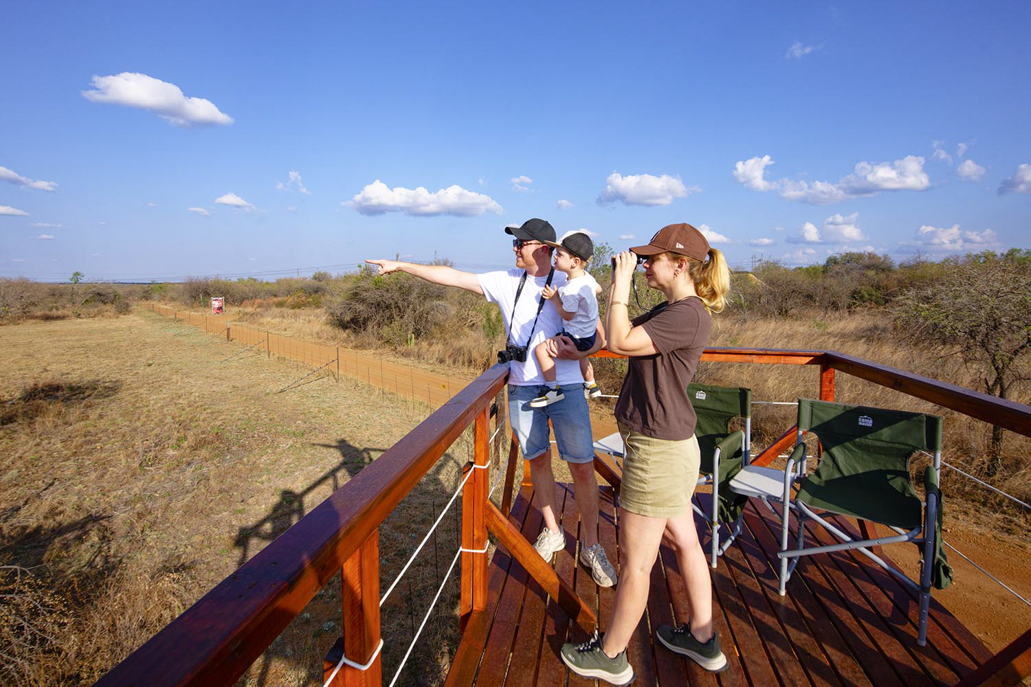 A family spotting wildlife from the Viewing Deck